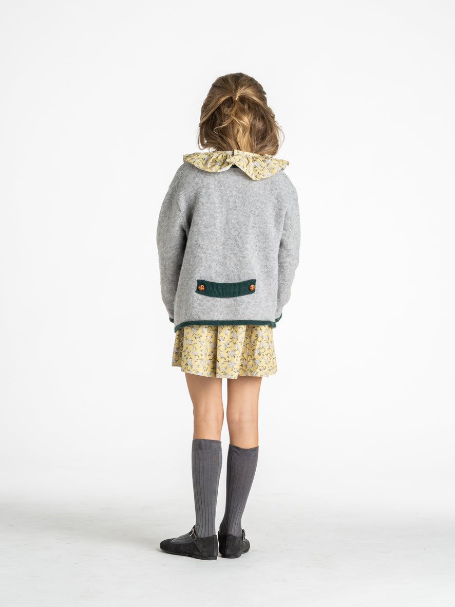 Veste en maille à bordure verte