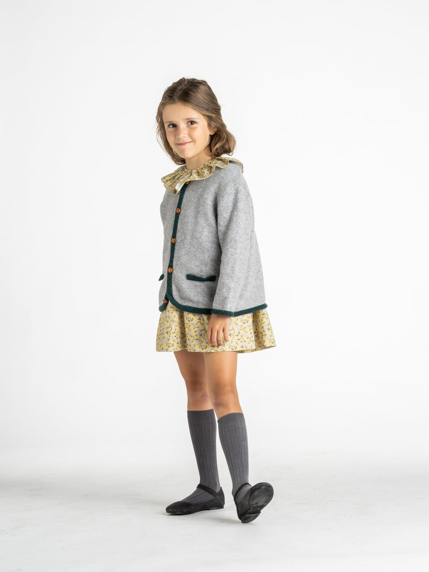 Veste en maille à bordure verte