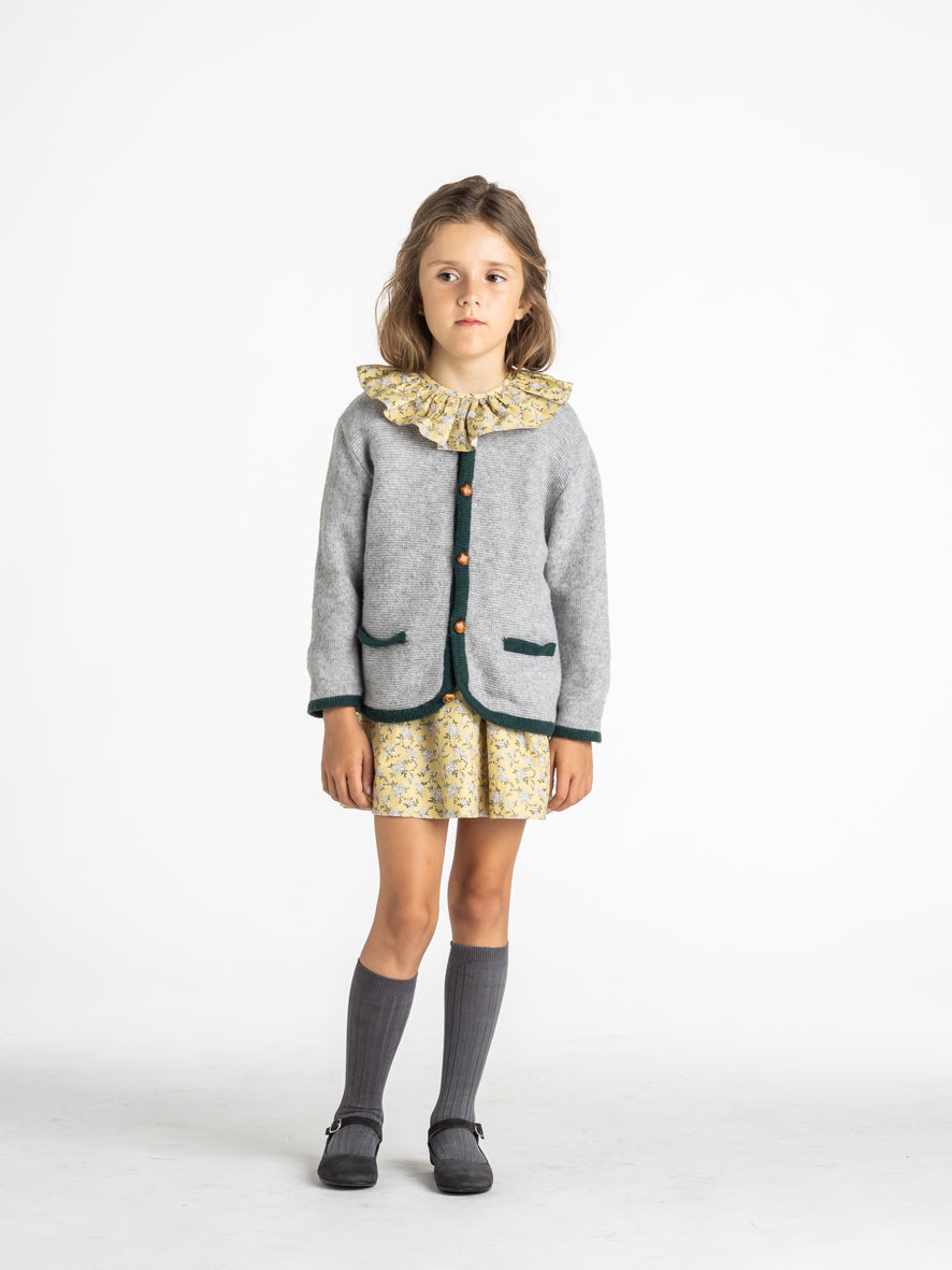 Veste en maille à bordure verte
