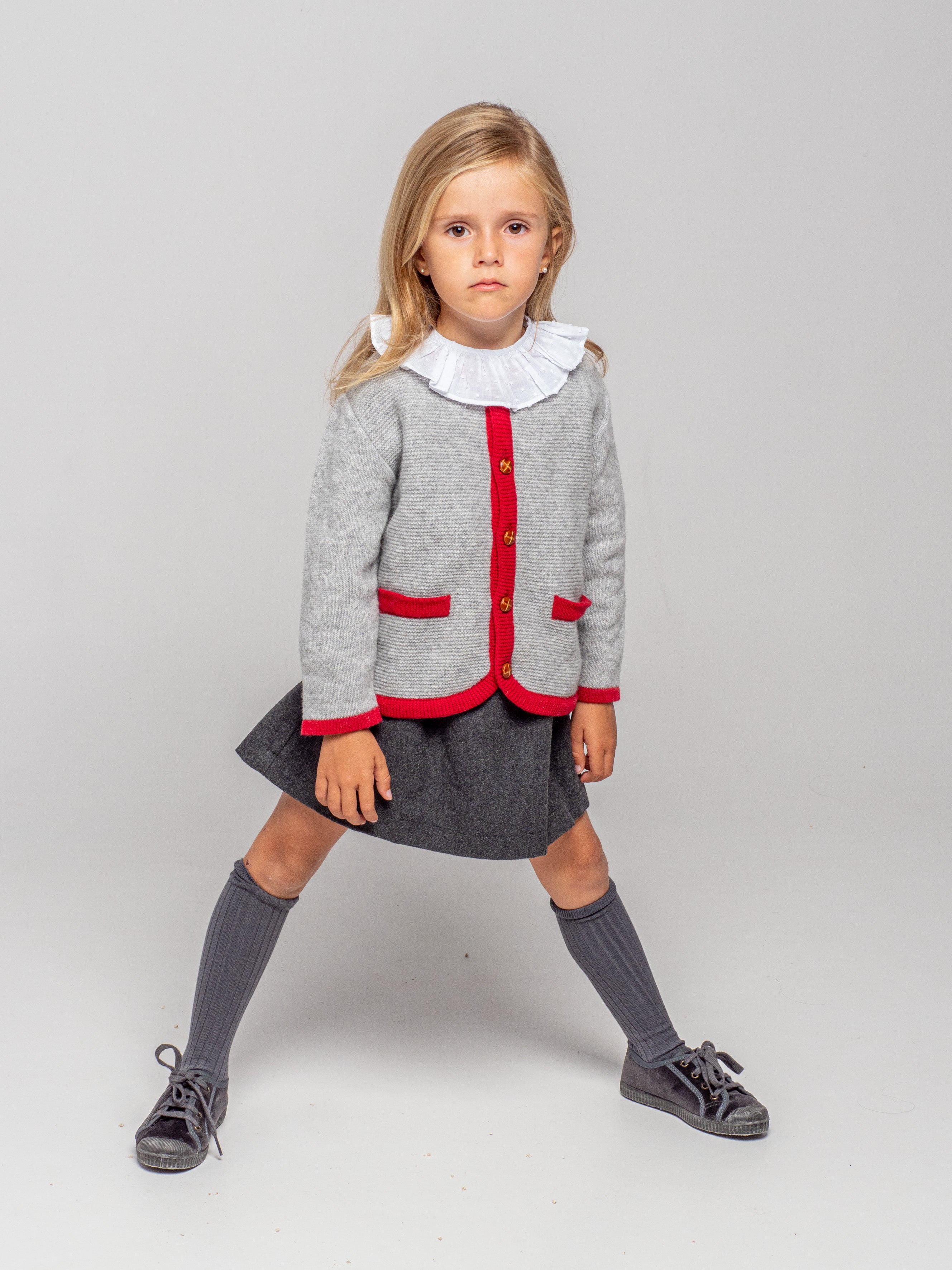 Veste tricotée à bordure rouge