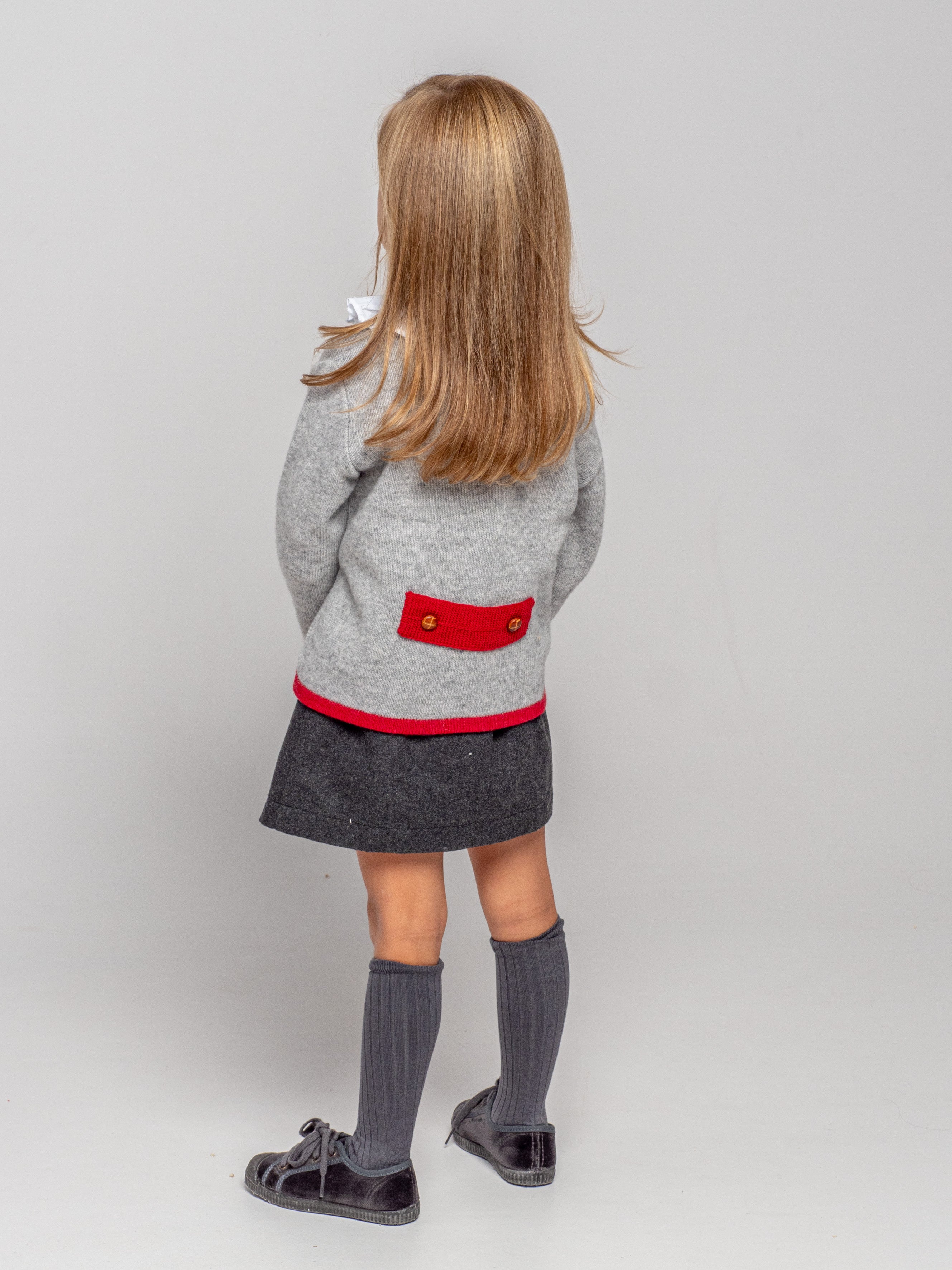 Veste tricotée à bordure rouge